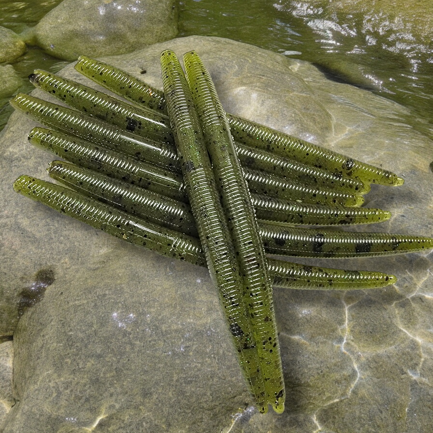 Nasties Stick Worms: 5-inch green soft plastics with black specks, ideal for Texas, Carolina, wacky, shakyhead rigs.